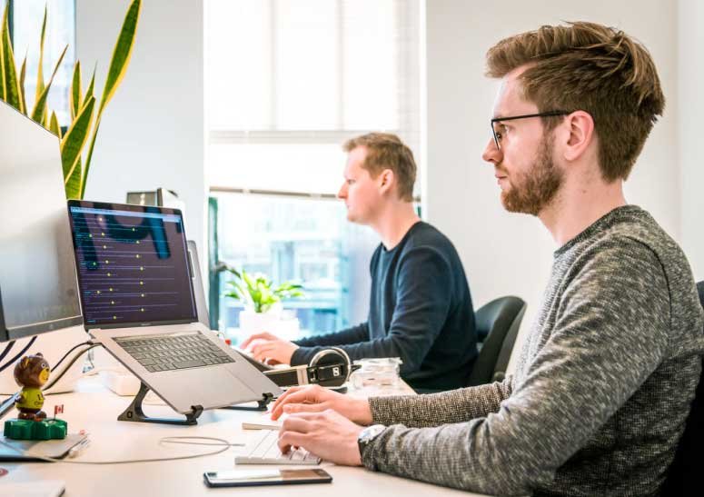 Sample Image: Two Men Researching Ideas on PC